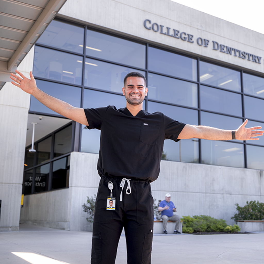 Jorge Ceballos standing outside the College of Dentistry