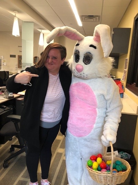 A bunny visits with staff at the college